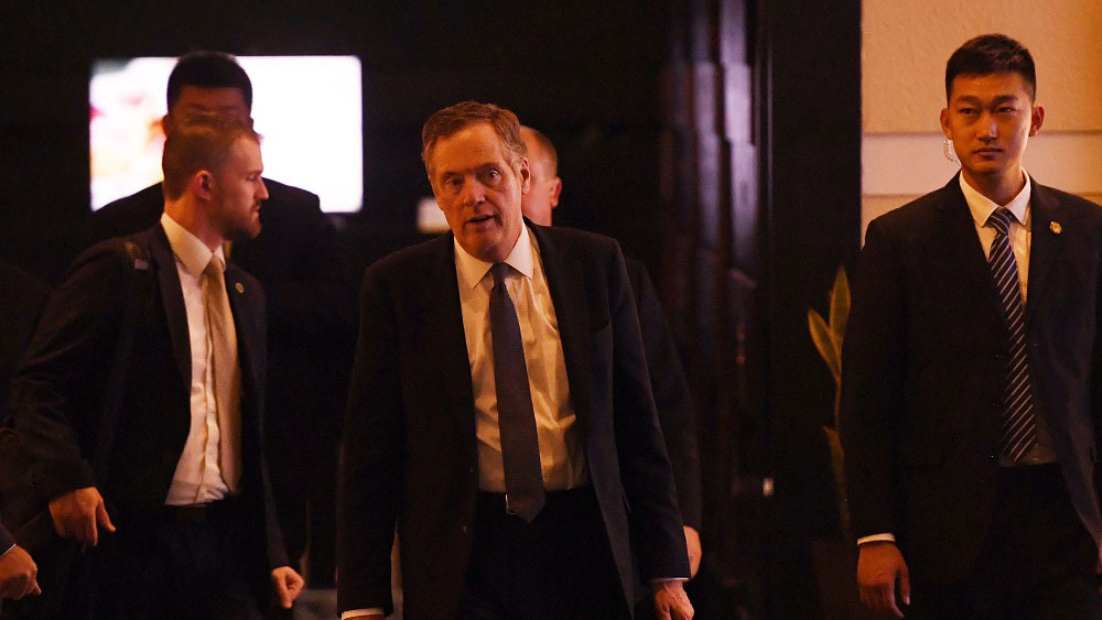 Robert Lighthizer walks through a hotel lobby